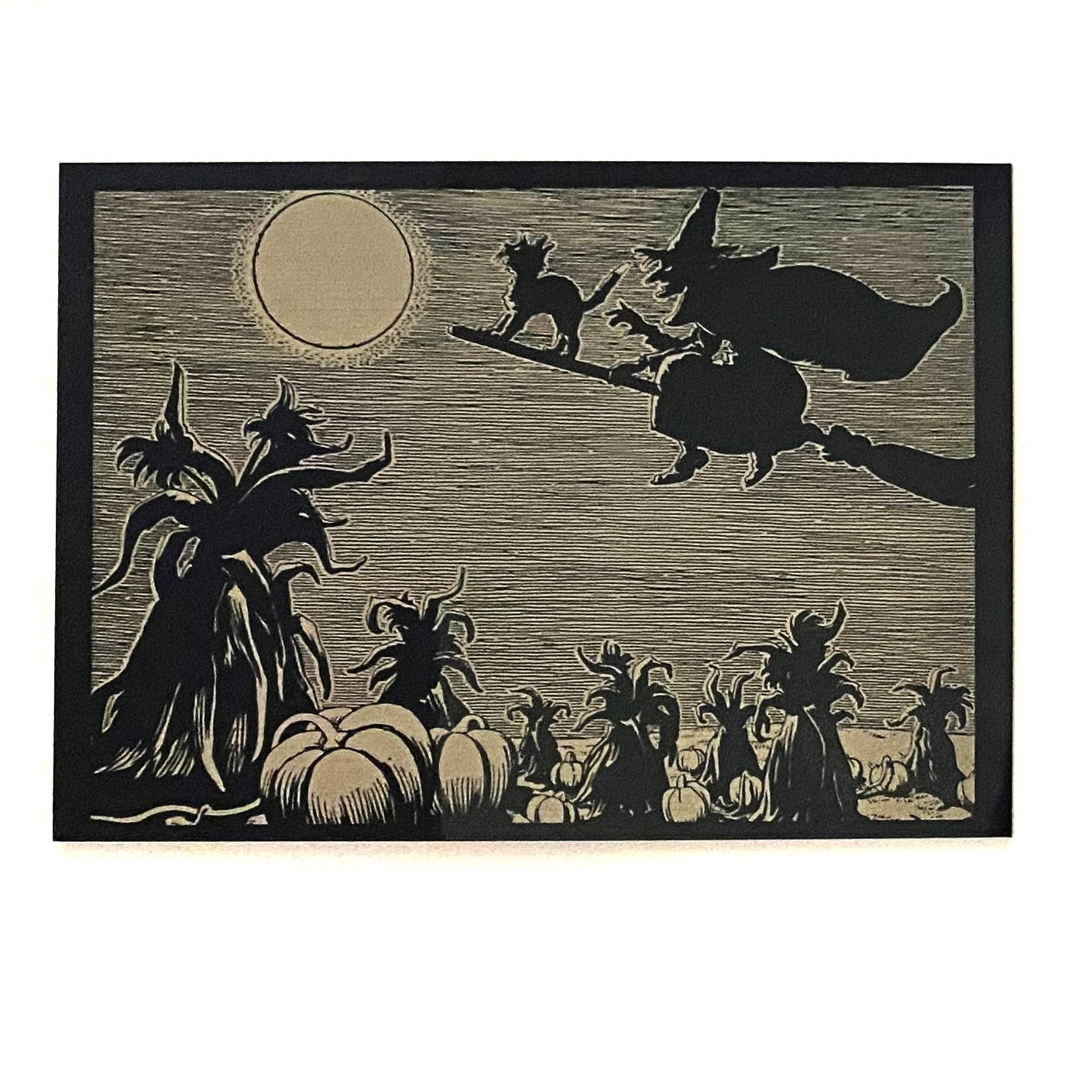 Decorative Halloween scene with pumpkins, witch, and moon on a black background.