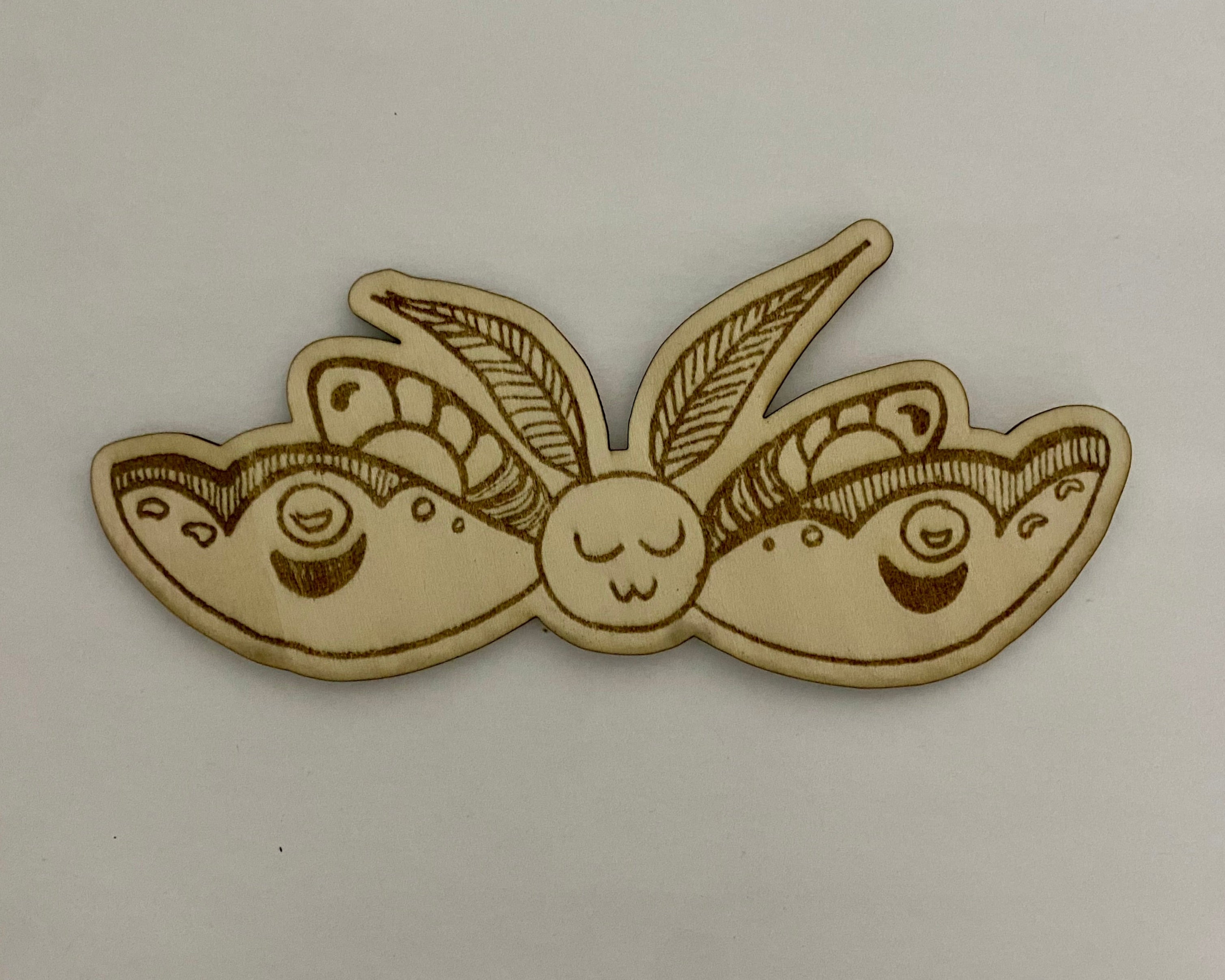 smiley moth on basswood